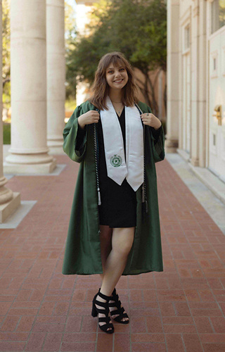 Paige Sanders wearing graduation regalia.