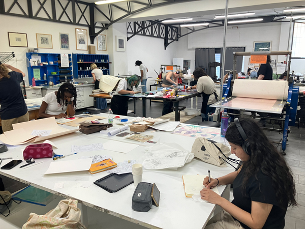 Students at work in a printmaking workshop.