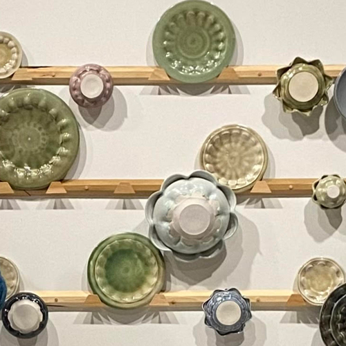 Ceramic plates and bowl mounted on a wall