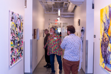 Guests enjoying graduate student work on display in the art annex.