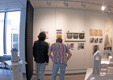 Guests looking at student work in the art building.