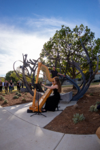 The Shadow Garden sculpture casts shadows onto countertenor Daniel Bubeck and harpist Ruth Mertens during their performance.
