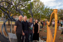 Eric Ligon standing with Shadow Garden artist Matthew Ritchie, countertenor Daniel Bubeck, and harpist Ruth Mertens after their performance.