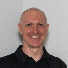 David Wolske smiling, black shirt