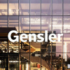 Gensler in white text with windows in the background