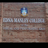 Sign on a brick wall: Edna Manley College of the Visual and Performing Arts