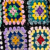 Detail of hand-embroidered colorful granny squares by Ashish