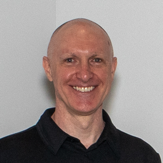 David Wolske smiling, white background