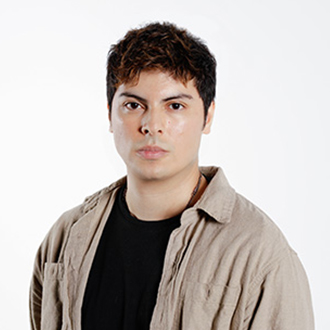 Juan facing forward, dark brown hair, beige jacket with a black shirt